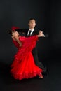 Dance ballroom couple in red dress dance pose isolated on black background. sensual professional dancers dancing walz, tango, slow