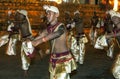 Dance of Beetle dancers perform along the streets of Kandy during the Esala Perahera in Sri Lanka.