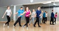 Adult people training in dance studio Royalty Free Stock Photo