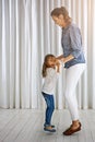 Dance, family and mother with girl in a living room for fun, bonding and teaching dancing steps in their home. Love, mom