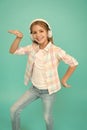 Dance folk dances. Girl child listen music with modern headphones. Kid little girl listen music headphones. Music Royalty Free Stock Photo