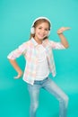 Dance folk dances. Girl child listen music with modern headphones. Kid little girl listen music headphones. Music Royalty Free Stock Photo