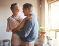 Dance, freedom and retirement with senior couple dancing in celebration, having fun and bonding in living room. Fun Royalty Free Stock Photo