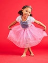 Dance, happy child and portrait in princess dress, fantasy and red background on studio mockup. Kids holding ballerina