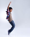 Dance, hip hop and young child dancer dancing  in a white studio background in a pose feeling excited. Talent Royalty Free Stock Photo