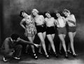 Dance instructor instructing five young women