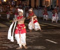 A Dance of Kothala performer parades through the streets of Kandy during the Esala Perahera in Sri Lanka.