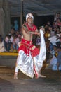 A Dance of Kothala performer parades through the streets of Kandy during the Esala Perahera in Sri Lanka.