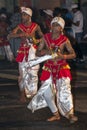 Dance of Kothala performers parade through the streets of Kandy during the Esala Perahera in Sri Lanka.