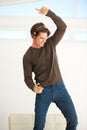 Dance like no one is watching. A handsome young man dancing to the music on his mp3 player. Royalty Free Stock Photo