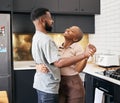 Dance, love and happy black couple in the kitchen having fun together in their new modern home. Happiness, smile and Royalty Free Stock Photo