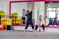 Dance men in the gym under the supervision of a teacher. Sports lifestyle.