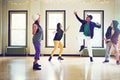 Dance moves that are all kinds of awesome. a group of young friends dancing together in a studio. Royalty Free Stock Photo