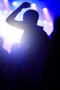 Dance, neon and silhouette of woman at music festival with crowd dancing at concert, lights and energy at live event Royalty Free Stock Photo