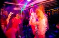 Dance party in night club in blurred motion. Royalty Free Stock Photo