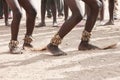 Dance on the sand. Feet of dancing Africans on the sandy surface