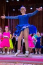 Dance school. Pupils take exams. Boys and girls in beautiful dance costumes on stage Royalty Free Stock Photo