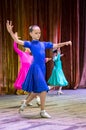 Dance school. Pupils take exams. Boys and girls in beautiful dance costumes on stage Royalty Free Stock Photo