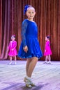 Dance school. Pupils take exams. Boys and girls in beautiful dance costumes on stage Royalty Free Stock Photo