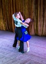 Dance school. Pupils take exams. Boys and girls in beautiful dance costumes on stage