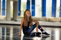 Dance styles street dancers, hip hop. Girl in a dance studio in a suit Royalty Free Stock Photo