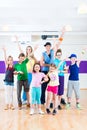 Dance teacher giving kids Zumba fitness class Royalty Free Stock Photo