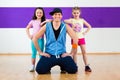 Dance teacher giving kids Zumba fitness class i Royalty Free Stock Photo