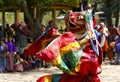 A dancer with colorful mask