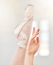 Dancer feet, leather ballet shoes with hands, calm ballerina dancing closeup in studio. Training performance grace Royalty Free Stock Photo