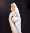 Dancer hand and foot on ballet shoe and hand, show posture and balance at dance class. Zoom of woman dancing in studio Royalty Free Stock Photo