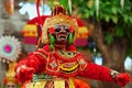 Dancer man in traditional Balinese costume and monkey mask