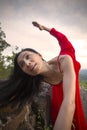 Dancer in red dress doing a lunge outdoors in Connecticut Royalty Free Stock Photo