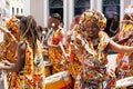 Dancer`s small parade with traditional costumes and instruments celebrating with revelers the Carnival, Brazil