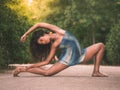 Dancer stretching on the floor in a park