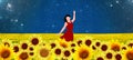 Dancer in a sunflowers field in red dress