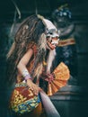 Dancer in traditional Balinese mask of demon Rangda