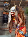 Dancer in traditional Balinese mask of demon Rangda