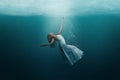 Dancer underwater in a state of peaceful levitation