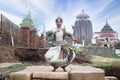 Dancer wears traditional costume and performs Odissi dance at Lingaraj Temple, Bhubaneswar, Odisha, India