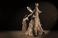 Dancers in ballroom against black background Royalty Free Stock Photo