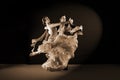 Dancers in ballroom against black background Royalty Free Stock Photo