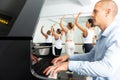 dancers doing exercises on stretching ballet barre under live music Royalty Free Stock Photo