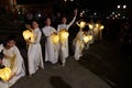 Dancers dressed in white with illuminated lanterns in a moment of the show represented in the streets of the city during the Integ Royalty Free Stock Photo