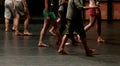 Dancers heating before a dance masterclass for adults legs detail