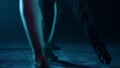 Dancers legs exercising latin movements. Ballroom couple feet dancing indoors.