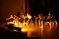 Dancers pulling hands forward on the stage