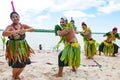 Dancers South Pacific. Young men and women dressed with typical dresses made from nature dancing traditional dances in Tonga.