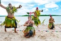 Dancers South Pacific. Young men and women dressed with typical dresses made from nature dancing traditional dances in Tonga.