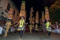 Dancers wearing colourful headwear prepare to participate in the Esala Perahara in Kandy, Sri Lanka.