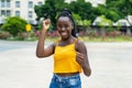 Dancing african american young adult woman with braids Royalty Free Stock Photo